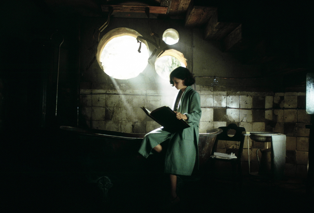 Ofelia reads from a book in Pan's Labyrinth